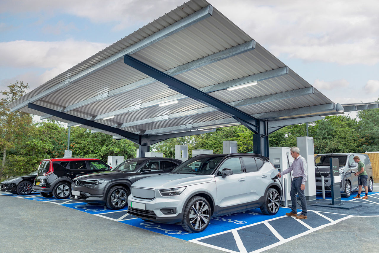 Cars being charged at an EV charging station.
