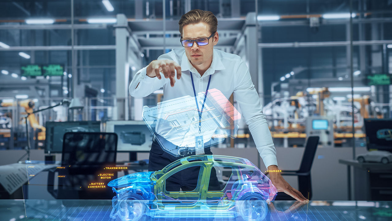 Automotive designer interacting with a VR model of vehicle. 