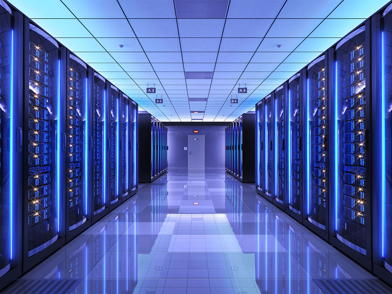 Corridor featuring server racks with blue LED status lights representing efficient data center thermal management.