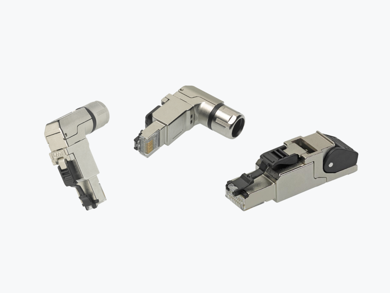 Close-up of three angled RJ45 shielded connectors. 