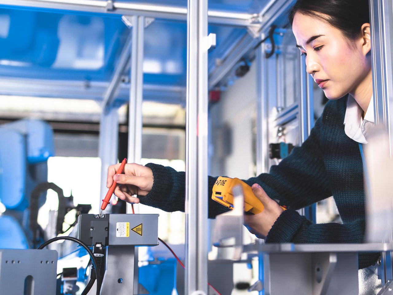 Engineer testing medical connectors during the design phase in a high-tech laboratory.