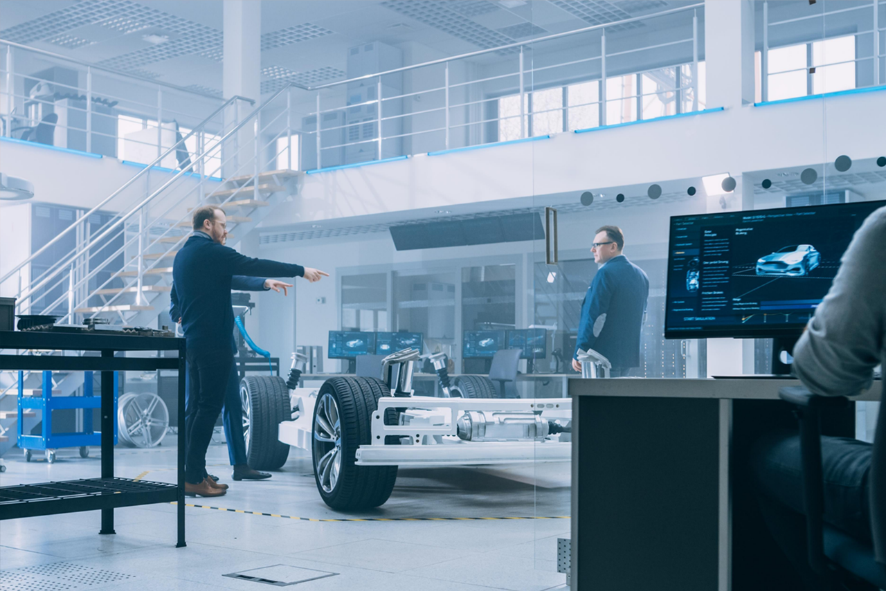 Engineers review connectivity options in a prototype automotive vehicle.