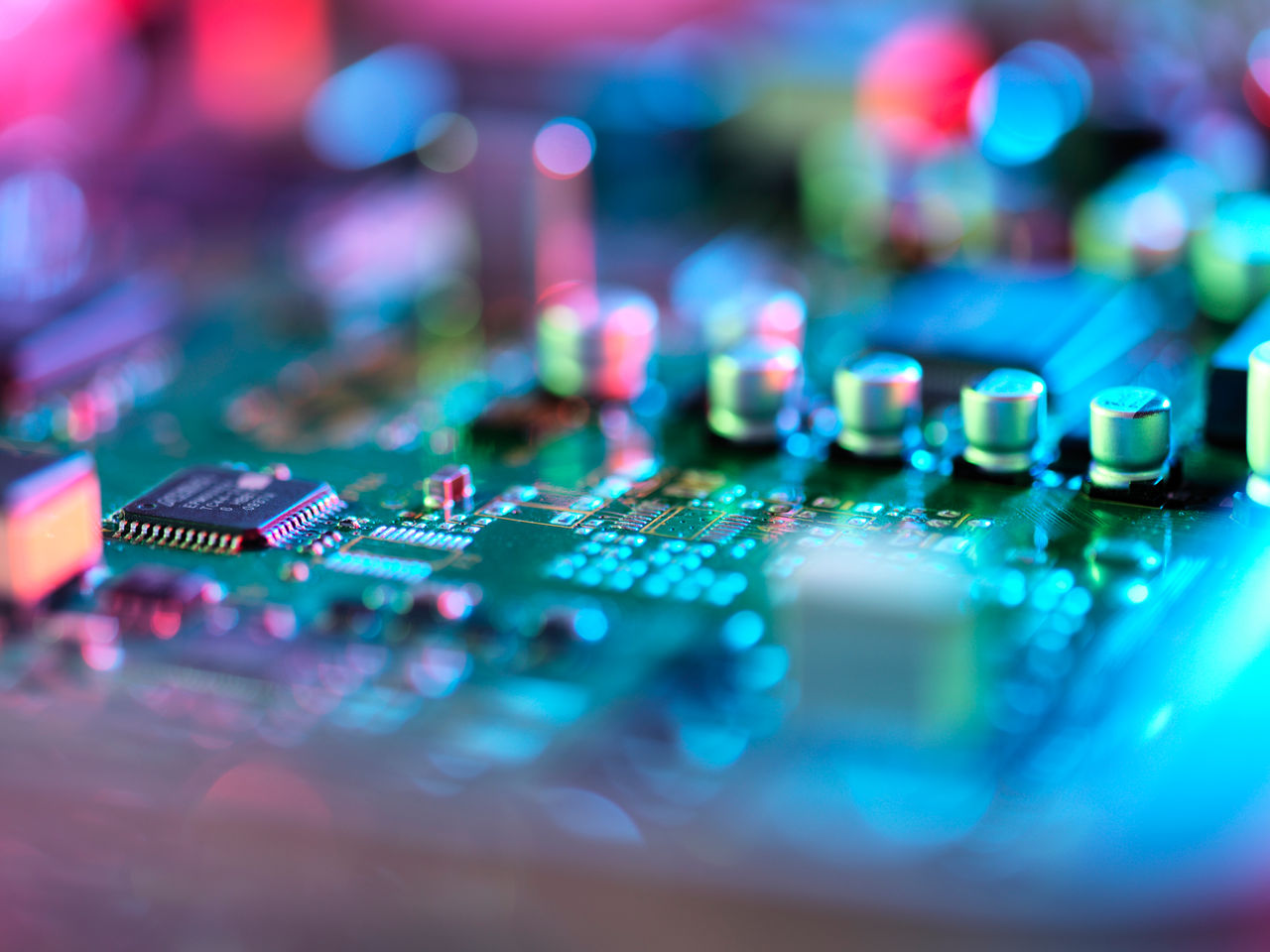 Miniaturized electronic components on a PCB.
