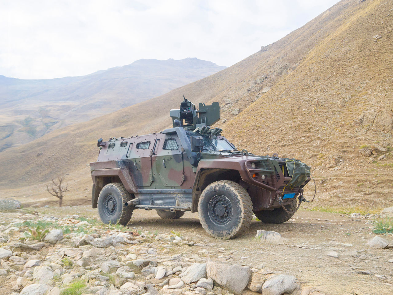 A rugged military vehicle representing rugged reliability in aerospace and defense. 